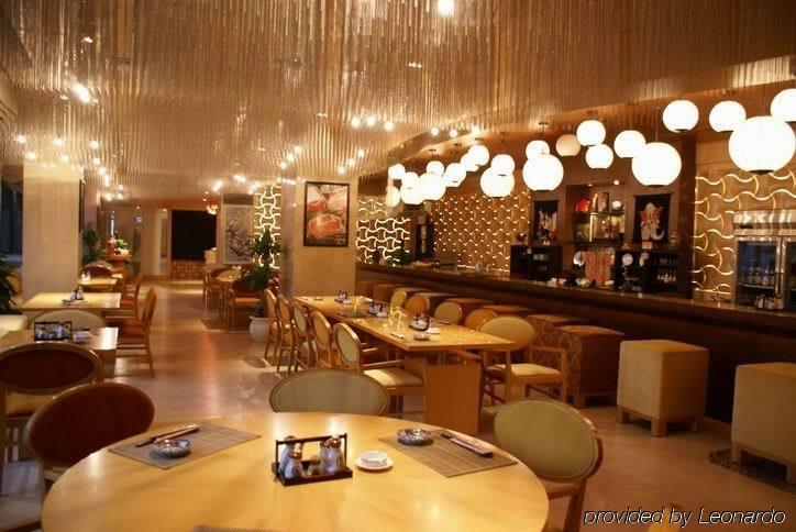 New Century Grand Hotel كايفنغ المطعم الصورة